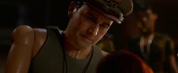 Movie still from “Welcome to Marwen” (2018), directed by Robert Zemeckis – A person wearing a hat; Close Up shot, Over the shoulder angle