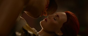 Movie still from “Welcome to Marwen” (2018), directed by Robert Zemeckis – A man and a woman are kissing in the dark; Extreme Close Up shot, Low angle