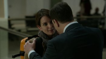 Movie still from “Whiskey Tango Foxtrot” (2016), directed by Glenn Ficarra – A man and a woman are hugging each other; Close Up shot, Over the shoulder angle