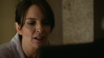Movie still from “Whiskey Tango Foxtrot” (2016), directed by Glenn Ficarra – A person using a computer; Close Up shot, Over the shoulder angle