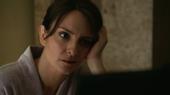 Movie still from “Whiskey Tango Foxtrot” (2016), directed by Glenn Ficarra – A person looking at a computer screen; Close Up shot, Over the shoulder angle