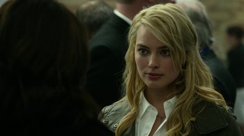 Movie still from “Whiskey Tango Foxtrot” (2016), directed by Glenn Ficarra – A beautiful blonde woman with long hair and blue eyes; Close Up shot, Over the shoulder angle