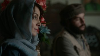 Movie still from “Whiskey Tango Foxtrot” (2016), directed by Glenn Ficarra – A person wearing a headscarf; Close Up shot, Over the shoulder angle