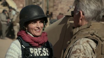 Movie still from “Whiskey Tango Foxtrot” (2016), directed by Glenn Ficarra – A man and a woman wearing a helmet; Close Up shot, Over the shoulder angle
