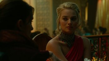 Movie still from “Whiskey Tango Foxtrot” (2016), directed by Glenn Ficarra – A woman in a red dress is talking to another woman; Close Up shot, Over the shoulder angle