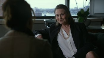 Movie still from “Whiskey Tango Foxtrot” (2016), directed by Glenn Ficarra – A woman sitting in front of another woman in an office setting; Close Up shot, Over the shoulder angle