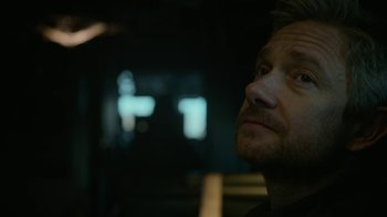 Movie still from “Whiskey Tango Foxtrot” (2016), directed by Glenn Ficarra – A person looking up at something; Close Up shot, Over the shoulder angle