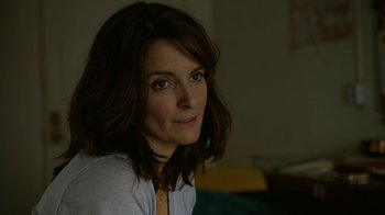 Movie still from “Whiskey Tango Foxtrot” (2016), directed by Glenn Ficarra – A person wearing a jacket; Close Up shot, Over the shoulder angle