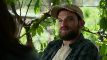 Movie still from “Whiskey Tango Foxtrot” (2016), directed by Glenn Ficarra – A man with a beard wearing a hat and a plaid shirt; Close Up shot, Over the shoulder angle