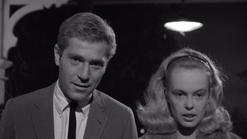 Movie still from “Who's Afraid of Virginia Woolf?” (1966), directed by Mike Nichols – A man and a woman standing next to each other; Close Up shot, Low angle