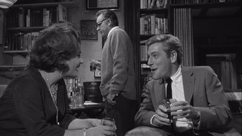 Movie still from “Who's Afraid of Virginia Woolf?” (1966), directed by Mike Nichols – A black and white photo of two men and a woman; Medium shot, Over the shoulder angle