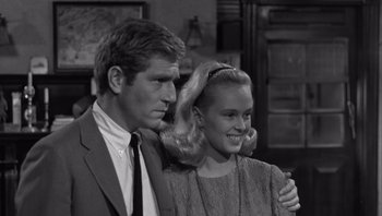 Movie still from “Who's Afraid of Virginia Woolf?” (1966), directed by Mike Nichols – A man and a woman standing next to each other; Medium shot, Over the shoulder angle