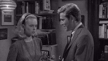 Movie still from “Who's Afraid of Virginia Woolf?” (1966), directed by Mike Nichols – A man and a woman talking to each other in a room; Medium shot, Over the shoulder angle