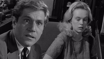 Movie still from “Who's Afraid of Virginia Woolf?” (1966), directed by Mike Nichols – A black and white photo of a man and a woman; Close Up shot, Over the shoulder angle