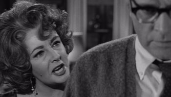 Movie still from “Who's Afraid of Virginia Woolf?” (1966), directed by Mike Nichols – An old black and white photo of a woman talking to a man; Close Up shot, Over the shoulder angle