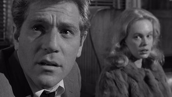 Movie still from “Who's Afraid of Virginia Woolf?” (1966), directed by Mike Nichols – A black and white photo of a man and a woman; Close Up shot, Over the shoulder angle