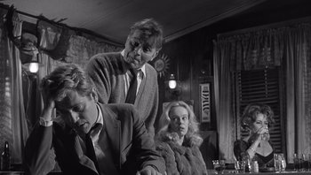 Movie still from “Who's Afraid of Virginia Woolf?” (1966), directed by Mike Nichols – A group of people sitting in a room; Medium shot, Over the shoulder angle