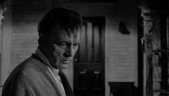 Movie still from “Who's Afraid of Virginia Woolf?” (1966), directed by Mike Nichols – Black and white photograph of a man wearing a neck tie; Close Up shot, Low angle