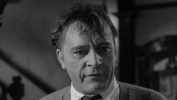 Movie still from “Who's Afraid of Virginia Woolf?” (1966), directed by Mike Nichols – Black and white photograph of a man in a tie; Close Up shot, Low angle