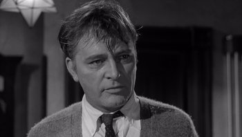 Movie still from “Who's Afraid of Virginia Woolf?” (1966), directed by Mike Nichols – An older man wearing a tie and a sweater; Close Up shot, Low angle