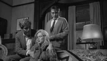 Movie still from “Who's Afraid of Virginia Woolf?” (1966), directed by Mike Nichols – Two men and a woman in a living room; Medium shot, Over the shoulder angle