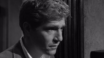 Movie still from “Who's Afraid of Virginia Woolf?” (1966), directed by Mike Nichols – Black and white photograph of a man looking to his left; Close Up shot, Low angle