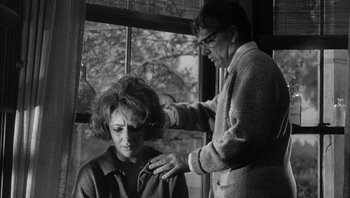 Movie still from “Who's Afraid of Virginia Woolf?” (1966), directed by Mike Nichols – An older woman is combing the hair of a younger woman; Medium shot, Low angle
