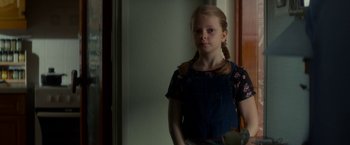 Movie still from “Wild Rose” (2018), directed by Tom Harper – A young girl standing in front of a mirror; Medium shot, Over the shoulder angle
