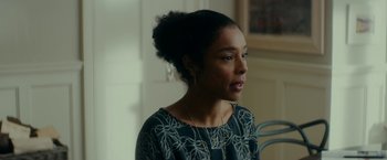 Movie still from “Wild Rose” (2018), directed by Tom Harper – A woman with a black and white top looking to her left; Close Up shot, Over the shoulder angle