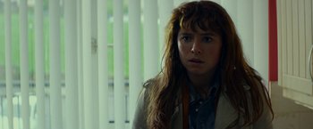 Movie still from “Wild Rose” (2018), directed by Tom Harper – A person with long hair; Close Up shot, Over the shoulder angle