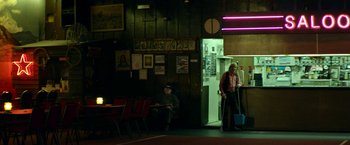 Movie still from “Wild Rose” (2018), directed by Tom Harper – Two people sitting in a room next to each other; Wide shot, Over the shoulder angle