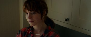 Movie still from “Wild Rose” (2018), directed by Tom Harper – A woman with a plaid shirt is looking to her left; Close Up shot, Low angle