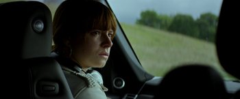 Movie still from “Wild Rose” (2018), directed by Tom Harper – A woman sitting in the driver's seat of a car; Close Up shot, Over the shoulder angle