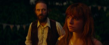 Movie still from “Wild Rose” (2018), directed by Tom Harper – A man and a woman standing next to each other; Close Up shot, Over the shoulder angle