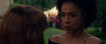 Movie still from “Wild Rose” (2018), directed by Tom Harper – A woman is looking at another woman in a crowd; Close Up shot, Over the shoulder angle