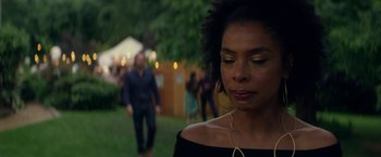 Movie still from “Wild Rose” (2018), directed by Tom Harper – A person wearing a black shirt; Close Up shot, Over the shoulder angle