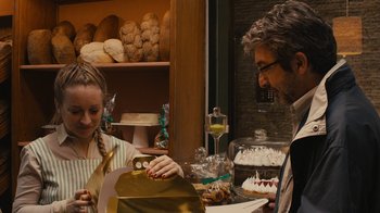 Movie still from “Wild Tales” (2014), directed by Damián Szifron – A man and a woman in front of a table of desserts; Close Up shot, Over the shoulder angle