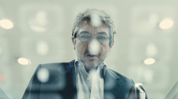 Movie still from “Wild Tales” (2014), directed by Damián Szifron – An older man wearing a suit and glasses; Close Up shot, Low angle