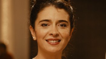 Movie still from “Wild Tales” (2014), directed by Damián Szifron – A woman smiling for the camera; Close Up shot, Low angle