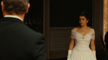 Movie still from “Wild Tales” (2014), directed by Damián Szifron – A woman in a white dress standing in front of a man; Medium shot, Over the shoulder angle