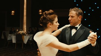 Movie still from “Wild Tales” (2014), directed by Damián Szifron – A man and a woman in formal wear dancing; Medium shot, Over the shoulder angle