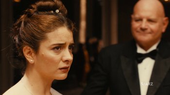 Movie still from “Wild Tales” (2014), directed by Damián Szifron – A person wearing a suit and tie; Close Up shot, Over the shoulder angle