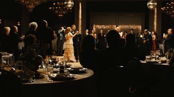 Movie still from “Wild Tales” (2014), directed by Damián Szifron – A group of people standing around a table; Wide shot, Over the shoulder angle
