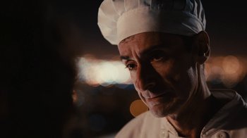 Movie still from “Wild Tales” (2014), directed by Damián Szifron – A man wearing a chef's hat and looking at the camera; Close Up shot, Over the shoulder angle