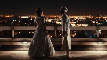 Movie still from “Wild Tales” (2014), directed by Damián Szifron – A man and a woman standing next to each other; Wide shot, Over the shoulder angle