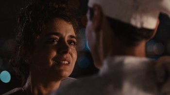 Movie still from “Wild Tales” (2014), directed by Damián Szifron – A woman smiles at a man wearing a white hat; Close Up shot, Over the shoulder angle