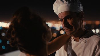 Movie still from “Wild Tales” (2014), directed by Damián Szifron – A man wearing a chef's hat is looking at another man's face; Close Up shot, Over the shoulder angle