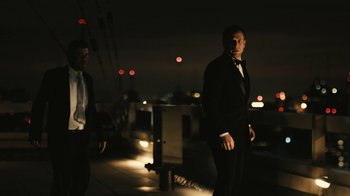 Movie still from “Wild Tales” (2014), directed by Damián Szifron – A man in a tuxedo standing next to another man in a suit; Wide shot, Low angle