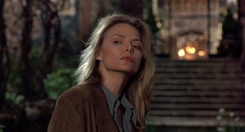 Movie still from “Wolf” (1994), directed by Mike Nichols – A woman with long blonde hair wearing a brown jacket; Close Up shot, Low angle