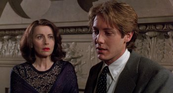 Movie still from “Wolf” (1994), directed by Mike Nichols – A man and a woman standing next to each other; Close Up shot, Over the shoulder angle